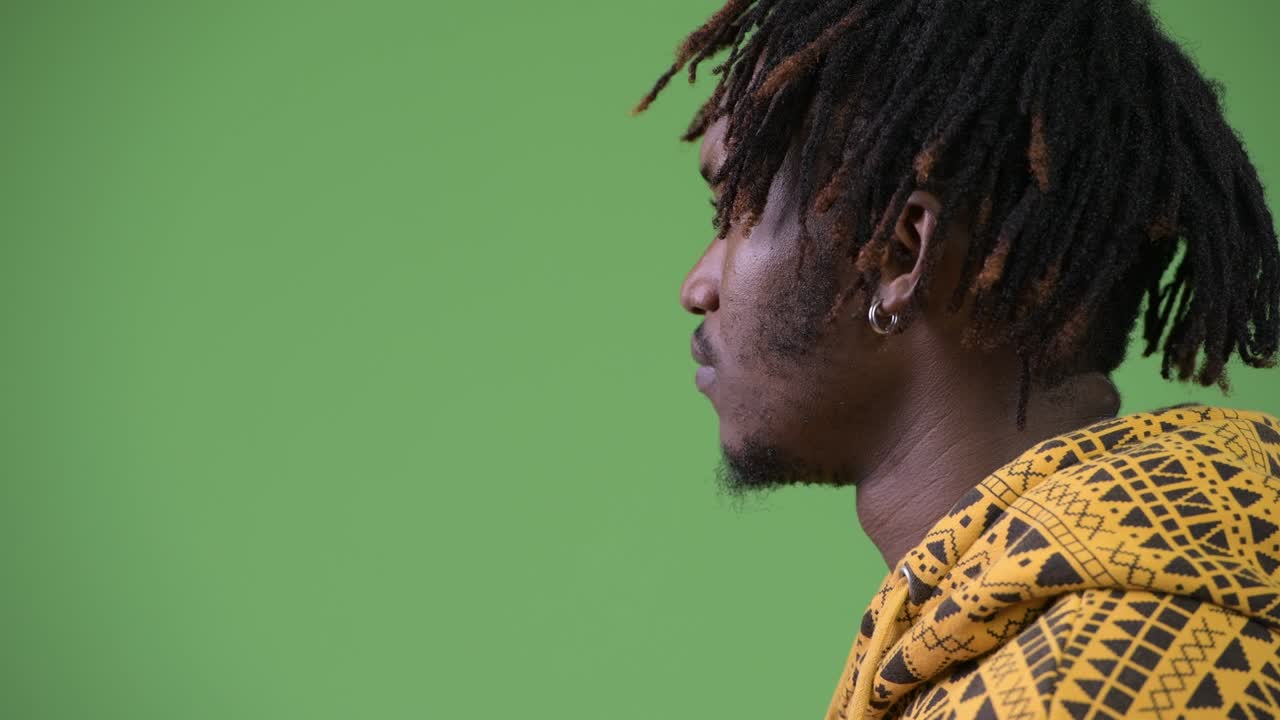 Profile view of young handsome African man