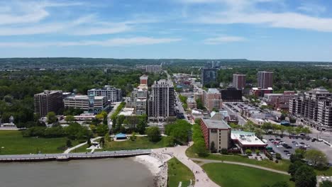 drone flying from lake to downtown burlington in summer