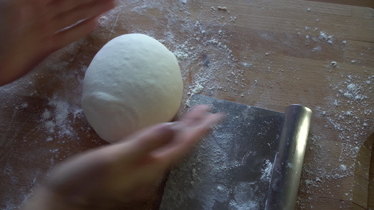 Chef preparing dough for pizza, croissants or bread