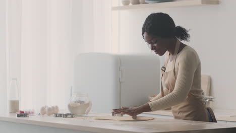 woman baking cookies in kitchen
