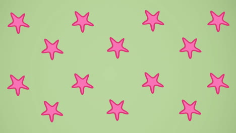 animation of pink starfish spinning on green background