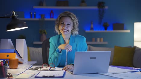 home office worker woman waving at camera.