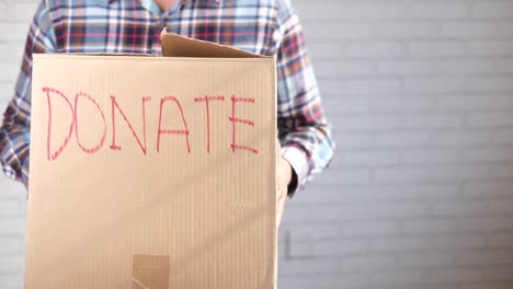 person holding a donation box