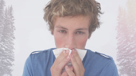 animation of ill man sneezing into tissue, over trees in winter landscape