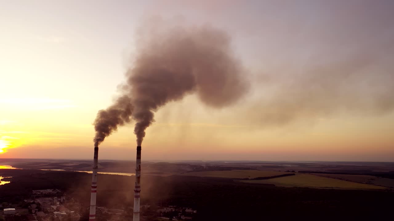 View of pipes with smoke. Landscape smoked polluted atmosphere from emissions of plant