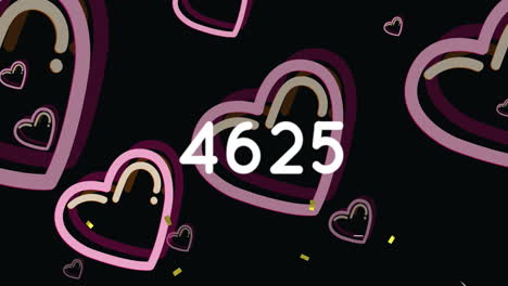 animación de confeti sobre números y iconos de corazón en fondo negro