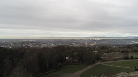 Aerial-view-landmark-historical-copper-dome-building-Ashton-Memorial-English-countryside-right-panning-reveal