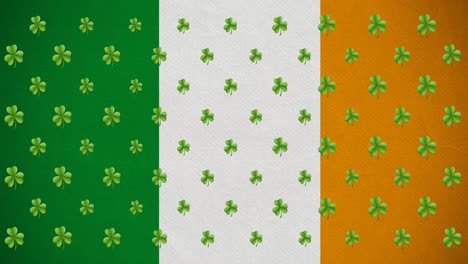 digital animation of multiple clover leaves moving against irish flag