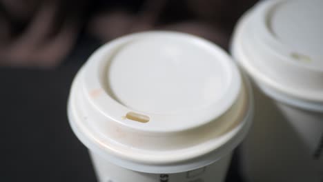 close up of coffee cup lids