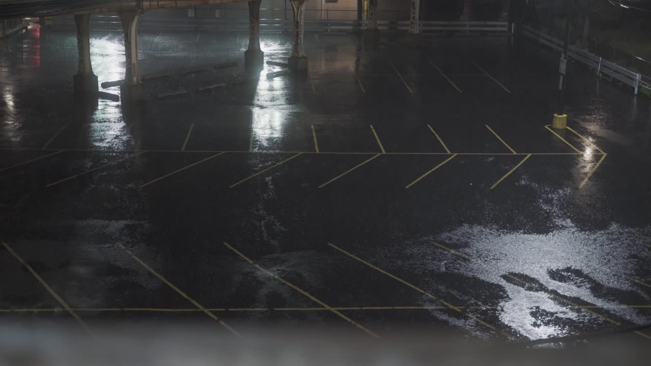 Empty Parking Lot at Night During a Heavy Rainstorm