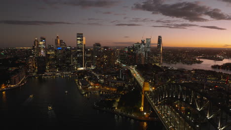 sydney harbor bridge and downtown sydney city skyline, australia, sunset, beautiful colorful afterglow, evening, wide cinematic establishing aerial