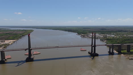 aerial view of a cable-stayed bridge spanning a wide river