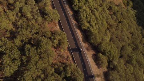 Riding-A-Motorbike-On-A-Mountain-Road-Aerial-View