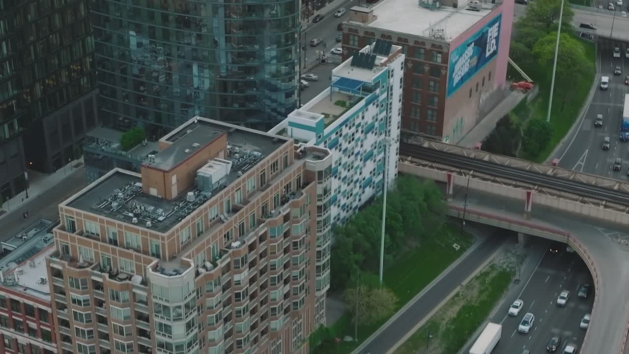 Aerial view of Chicago buildings and traffic on a busy highway