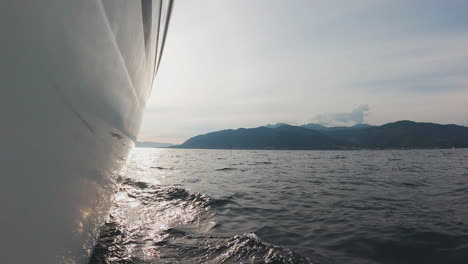 boat on the sea with mountains in the background