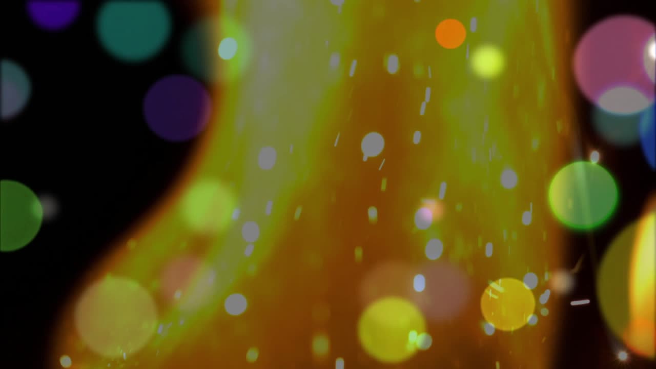 Bokeh circles drifting initiating amber-orange shape rising and emitting sparks forming interplay