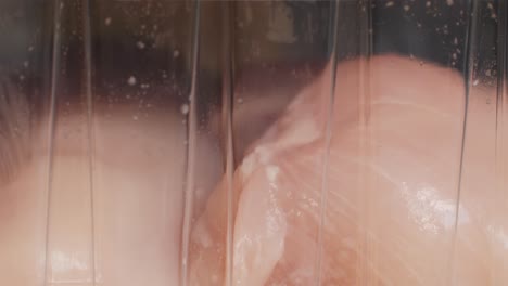 raw chicken breast in plastic containers