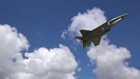 fighter jet in flight against a cloudy sky