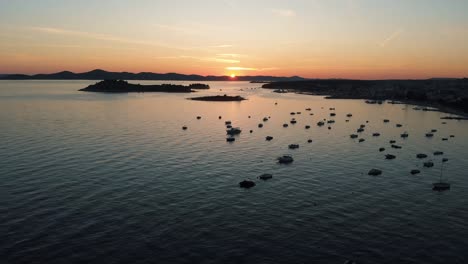 sail boats and yachts docked and beautiful golden colors