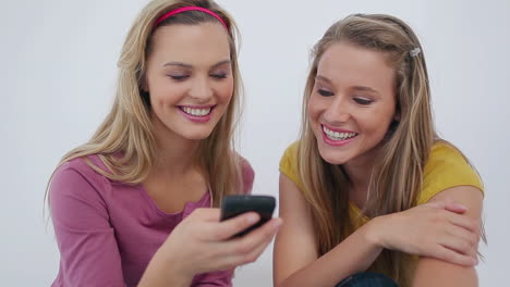 laughing friends text messaging