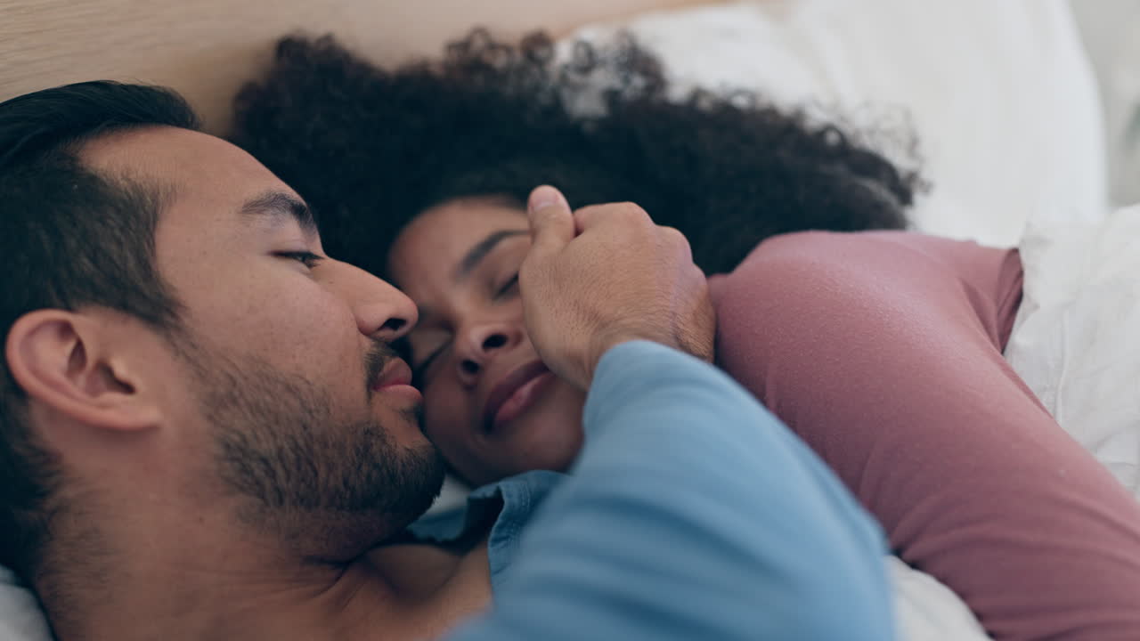 Love, intimacy and couple hands in a bed touch