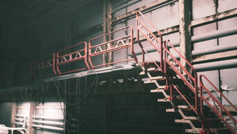 rusty metal stairs in a dark industrial building