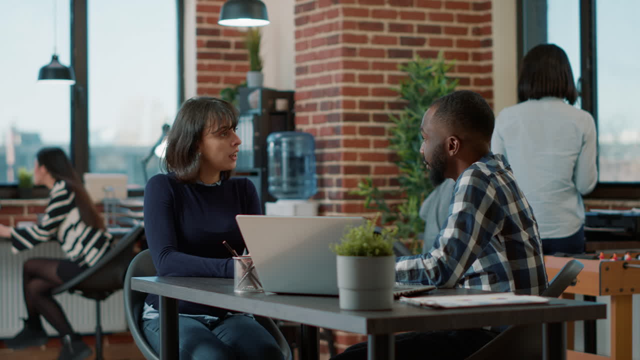 Male employee greeting female candidate at job interview