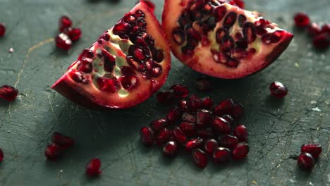 ripe pomegranate halves on board