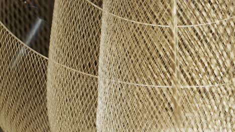 chandeliers made of golden mesh hanging - low angle shot