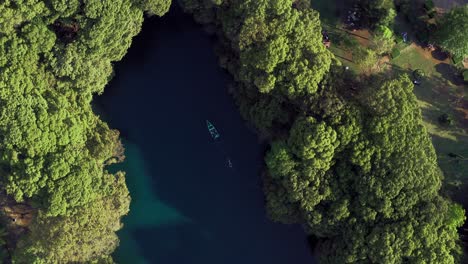 AERIAL:-Lago-De-Camecuaro,-Boat,-Swimmer,-Tangancicuaro,-Mexico