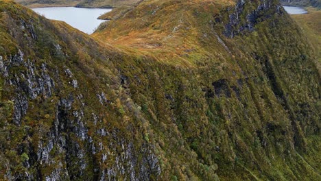 Aerial-over-the-rugged-hills-and-lakes-near-Vanylven-Municipality,-Norway