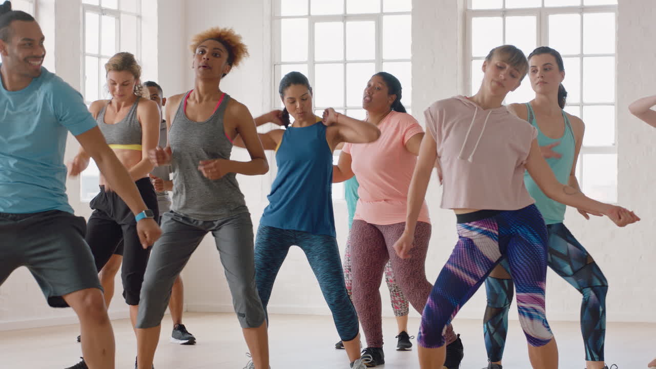 dance class happy group of multi ethnic people dancing enjoying training workout practicing choreography moves in fitness studio