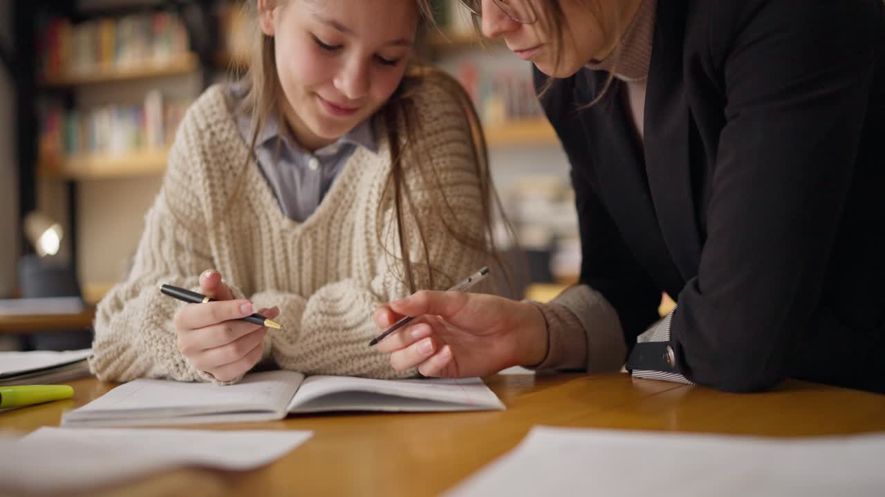 Teenager and Mother Working on Homework Together