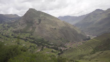 view of a mountain and valley in ancient inca terraces and ruins at the pisac archaeological park in pisac, cuzco region, peru