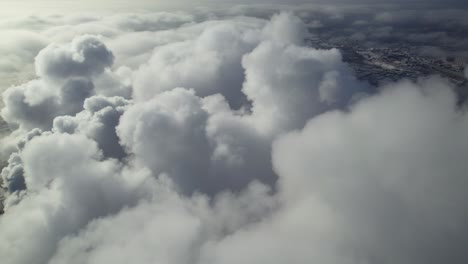 aerial view of clouds over a cityscape