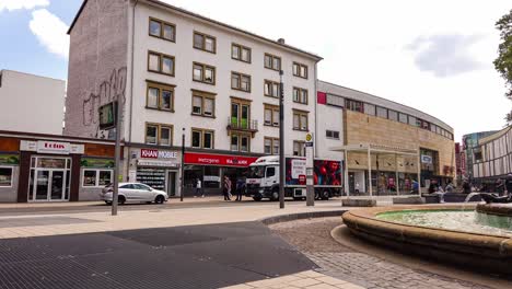panning time-lapse of public transportation and downtown street view in kaiserslautern, germany