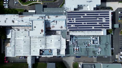 drone aerial roof shot of hospital building solar panels location healthcare carpark installation roofing gosford wyoming central coast australia