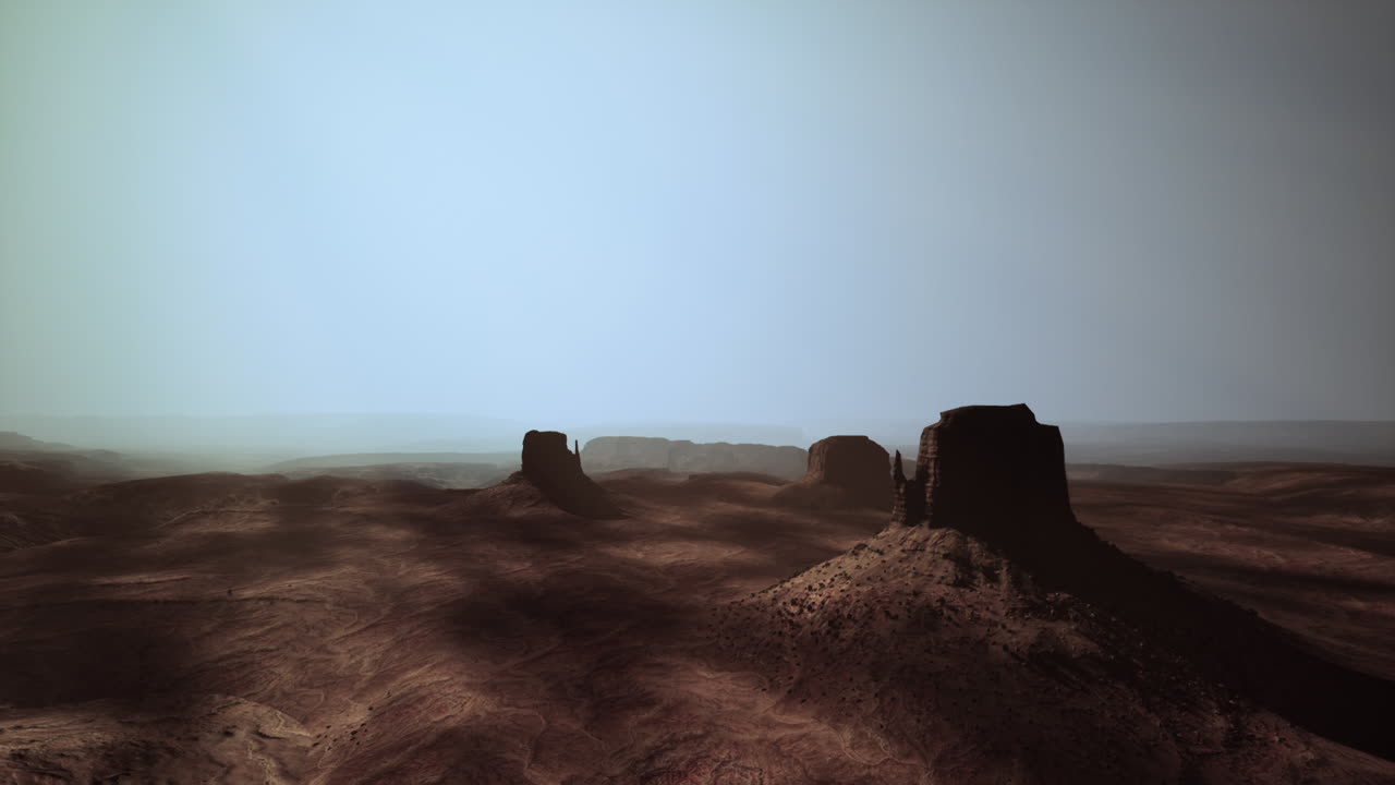 Paesaggio desertico della Monument Valley al crepuscolo con butte e cielo