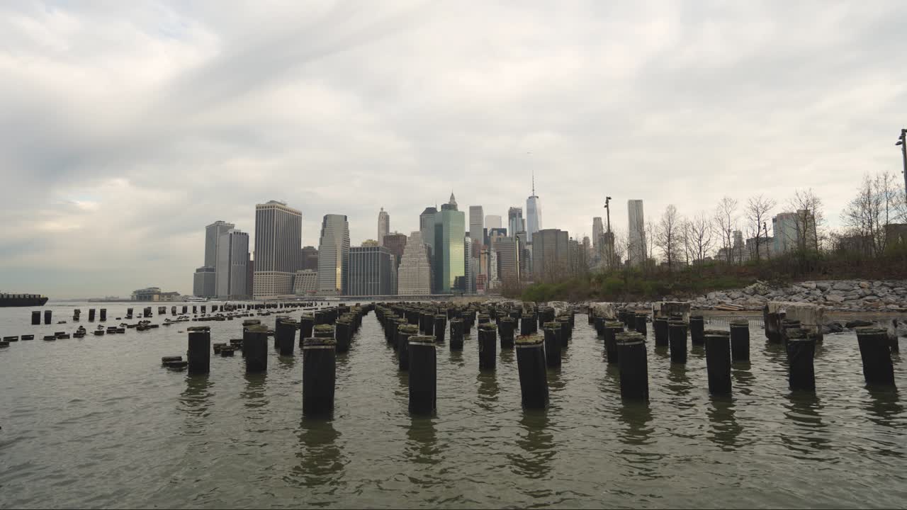 Time Lapse of Clouds Above Manhattan Waterfront, New York USA, View From Brooklyn Bridge Park