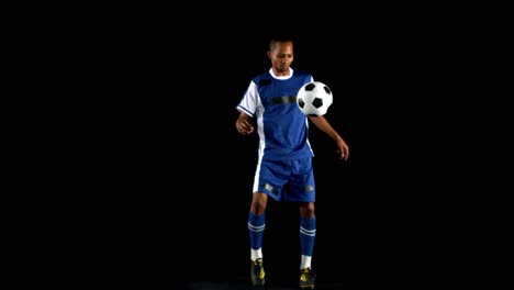 handsome man juggling a football