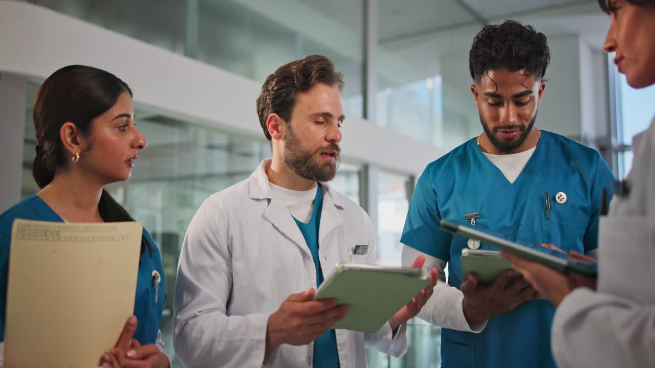 Diverse Medical Team Discussing Patient Records in a Modern Hospital