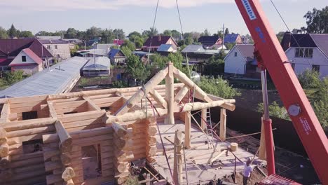 log cabin construction with crane