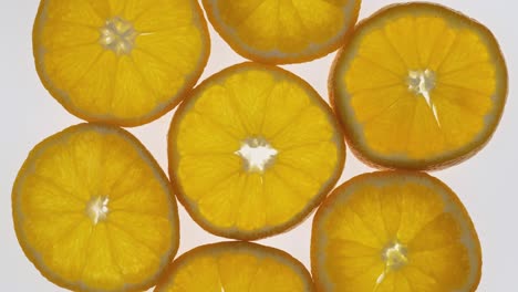 collection of fresh mandarin slices on white background. rotation citrus fruit. top view.