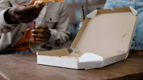 close-up of pizza inside a carton box