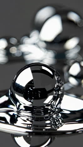 reflective black liquid drop and ripples
