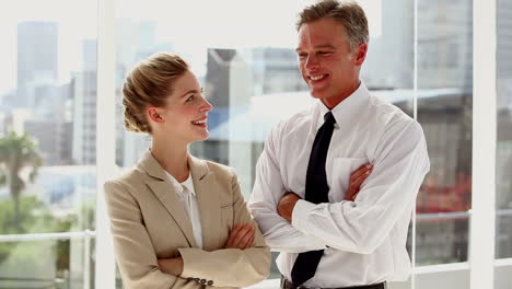 Standing-business-people-with-arms-folded