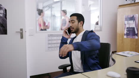 gym receptionist on phone