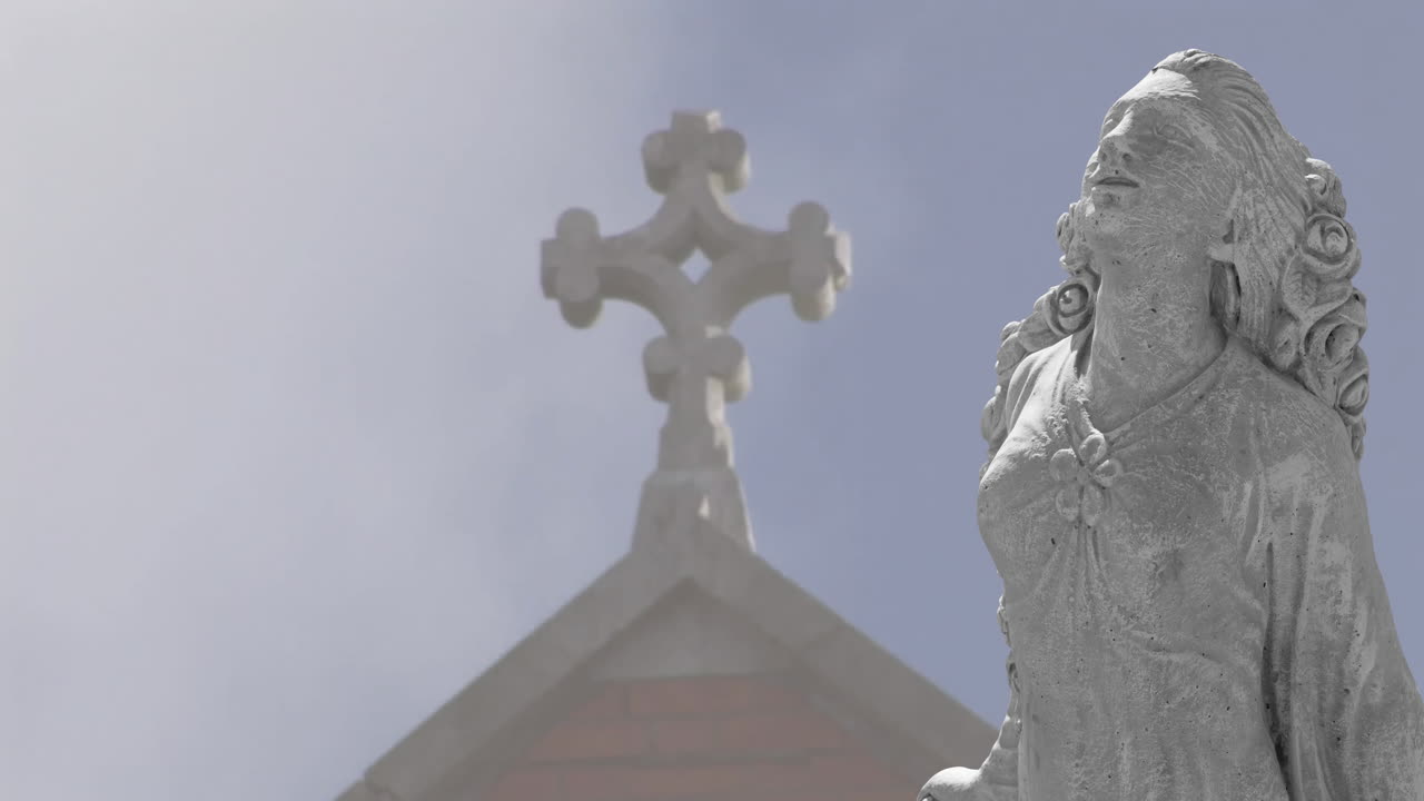 Animation of stone sculpture over roof and sky with clouds
