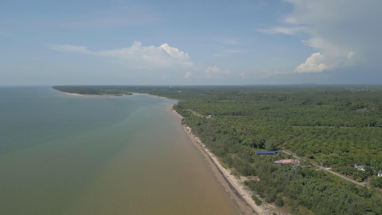 Aerial Drone View During Summer Alit Fishing Village,Kabong With, Facing Open Blue Sea, White Sandy Beach,Green Coconut, Palm Trees,And River,Sarawak,Borneo