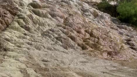 Mineral-cascade-waterfall-in-middle-east-Asia-water-reflection-the-sun-in-summer-time-season-in-Damash-Gilan-ancient-flow-calcium-carbonated-liquid-famous-natural-nature-heritage-landmark-attraction